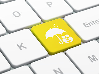 Image showing Safety concept: Family And Umbrella on computer keyboard background