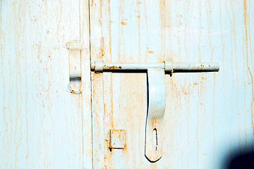 Image showing blue metal rusty  in    facade home and safe padlock 