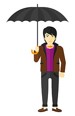 Image showing Businessman standing with umbrella.