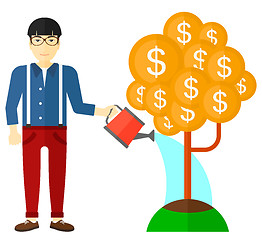 Image showing Man watering money tree.