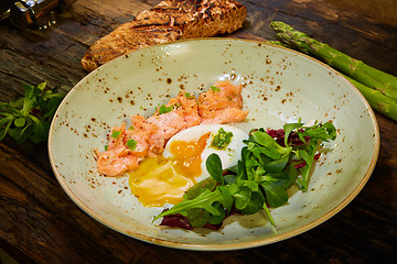 Image showing Poached eggs with salmon and rasparagus