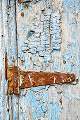 Image showing   paint in the blue wood door and morocco knocker