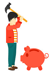 Image showing Man breaking piggy bank.