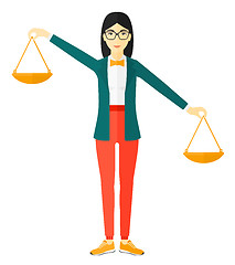 Image showing Business woman with scales.