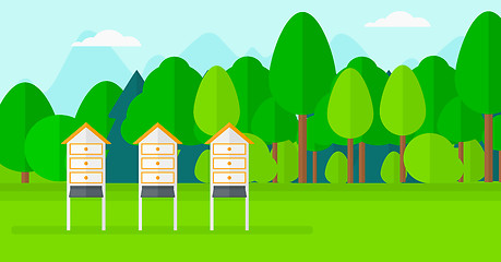 Image showing Background of beehives in meadow.
