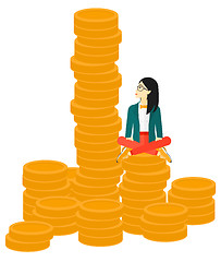 Image showing Business woman sitting on gold.