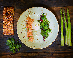 Image showing Poached eggs with salmon and rasparagus