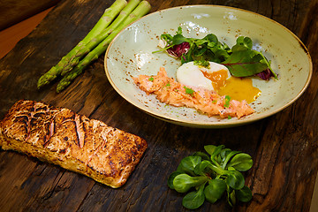 Image showing Poached eggs with salmon and rasparagus