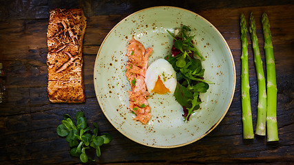 Image showing Poached eggs with salmon and rasparagus