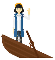 Image showing Business woman standing in sinking boat.