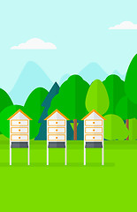 Image showing Background of beehives in meadow.