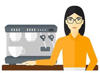 Image showing Barista standing near coffee maker.