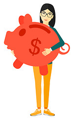 Image showing Woman carrying piggy bank.