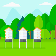 Image showing Background of beehives in meadow.