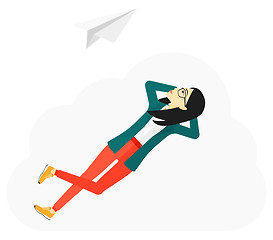 Image showing Business woman relaxing on cloud.