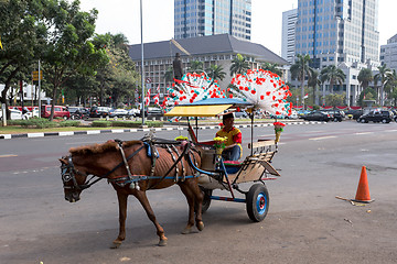 Image showing horse drawn carriage in the streets of Jakarta