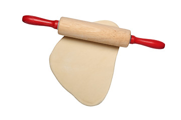 Image showing Flattened dough with rolling pin