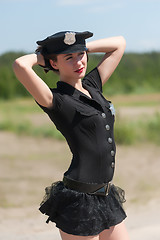 Image showing Sexy police woman in summer day