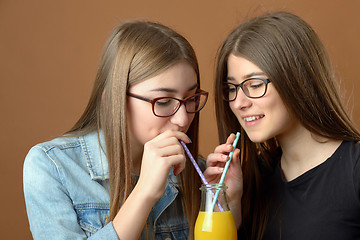 Image showing Girls sharing a drink