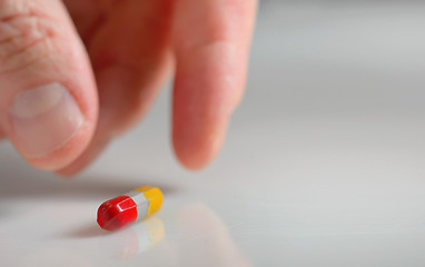 Image showing taking the pill