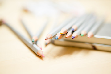 Image showing Close up of color pencils over wooden background