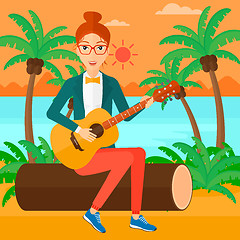 Image showing Woman playing guitar.