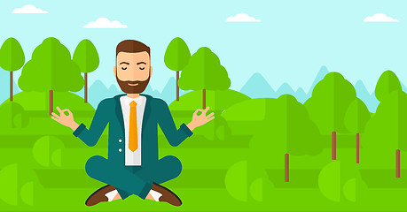 Image showing Businessman meditating in lotus pose.