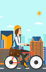 Image showing Woman cycling to work.