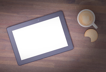 Image showing Tablet touch computer gadget on wooden table