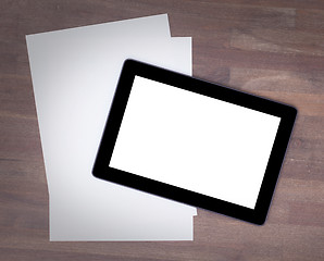 Image showing Tablet touch computer gadget on wooden table