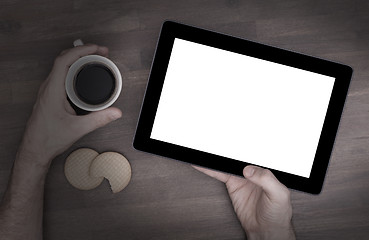 Image showing Tablet touch computer gadget on wooden table