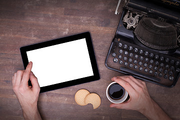 Image showing Tablet touch computer gadget on wooden table