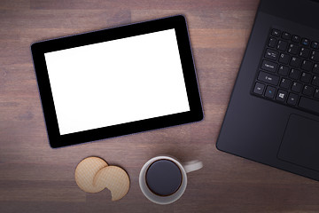 Image showing Tablet touch computer gadget on wooden table