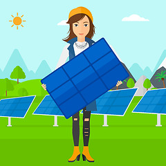 Image showing Woman holding solar panel.