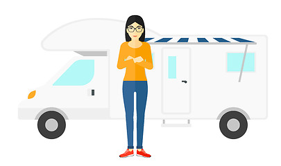 Image showing Woman standing in front of motor home.