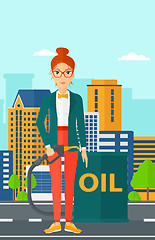 Image showing Woman with oil can and filling nozzle.