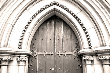 Image showing brown wooden parliament in london old  door and marble antique  