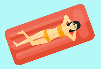 Image showing Woman relaxing in swimming pool.