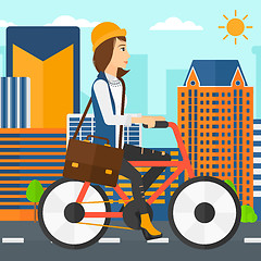 Image showing Woman cycling to work.