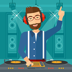 Image showing Smiling DJ with console.