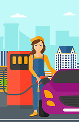 Image showing Woman filling up fuel into car.