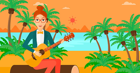 Image showing Woman playing guitar.