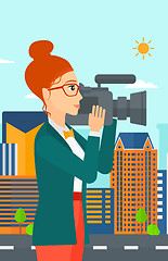 Image showing Camerawoman with video camera.