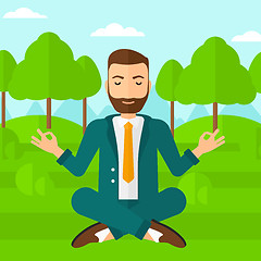 Image showing Businessman meditating in lotus pose.