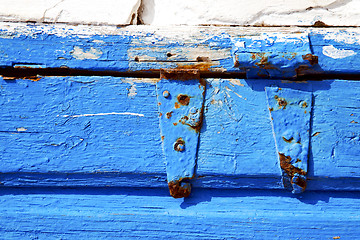 Image showing rusty metal    stripped paint in   door and morocco knocker