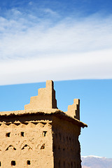 Image showing brown old   and  clouds  near the tower