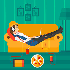 Image showing Woman lying on sofa with many gadgets.