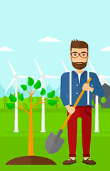 Image showing Man plants tree.