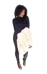 Image showing African American woman with fur coat over arm.