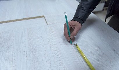 Image showing carpenter worker measuring